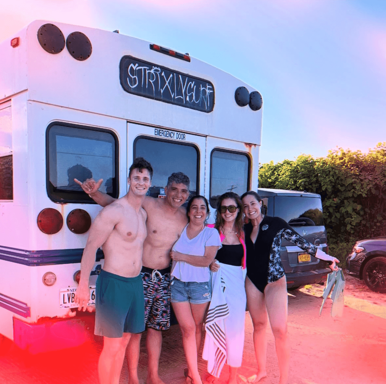Surfers gathering by the van at Ditch Plains