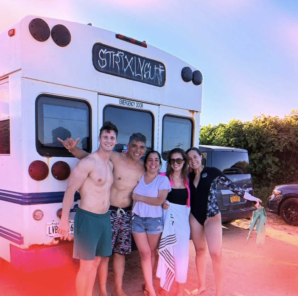 Surfers gathering by the van at Ditch Plains