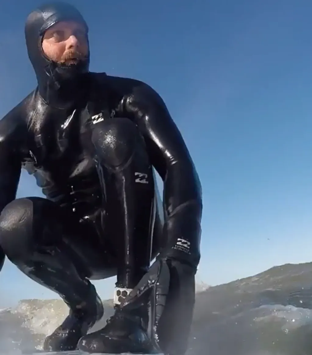 Jared Bono, Strictly Surf instructor, in a wetsuit on the water on Long Island's East End
