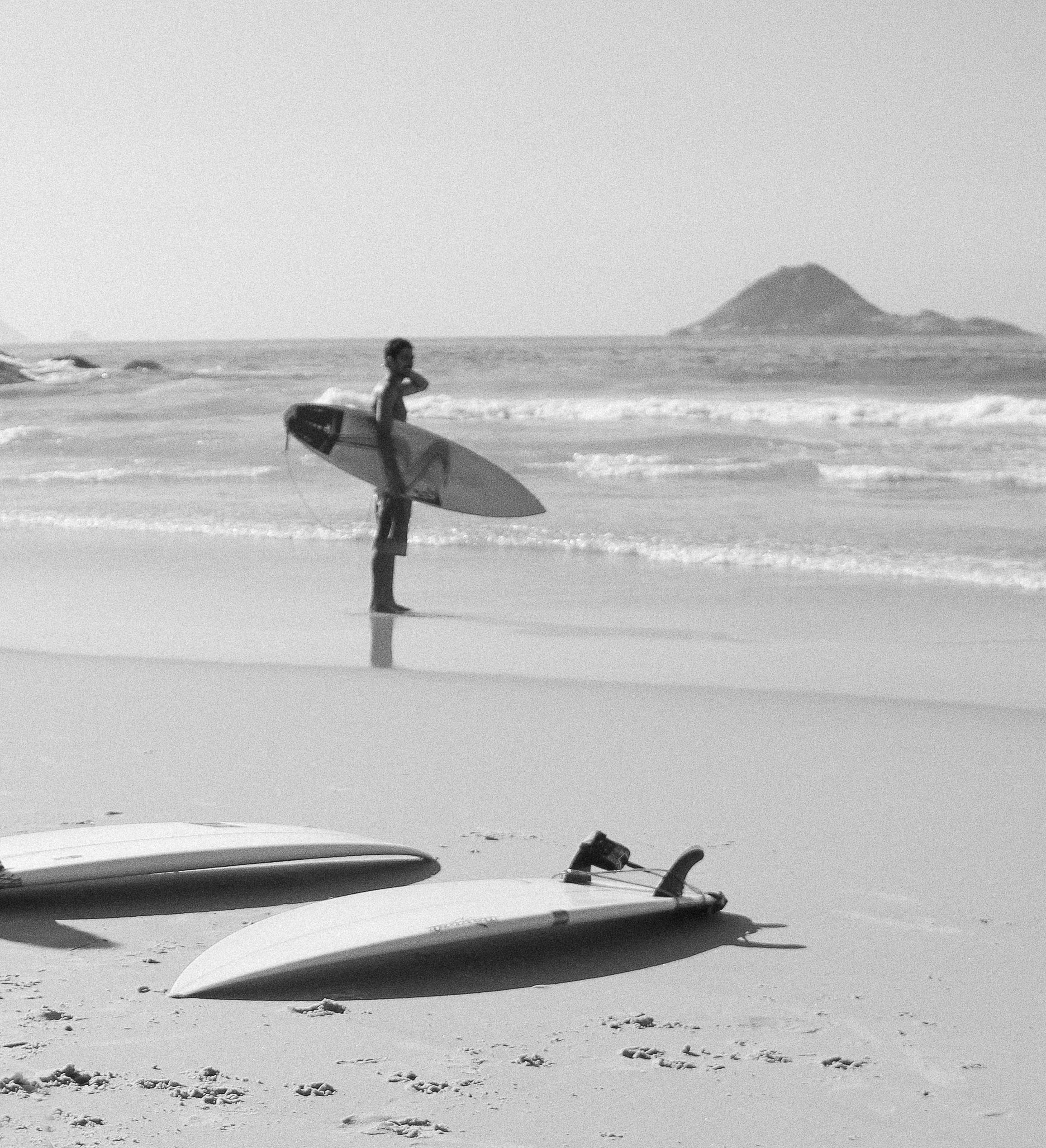 Instructor teaching a student how to surf